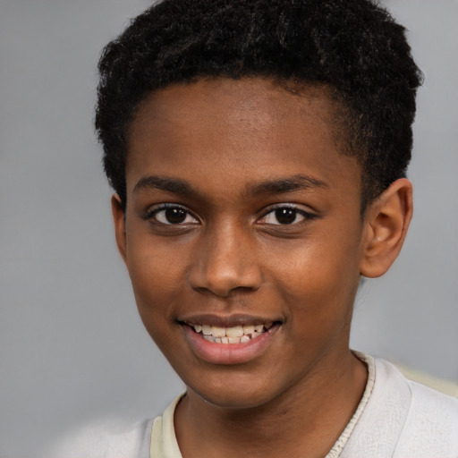 Joyful black young-adult male with short  brown hair and brown eyes