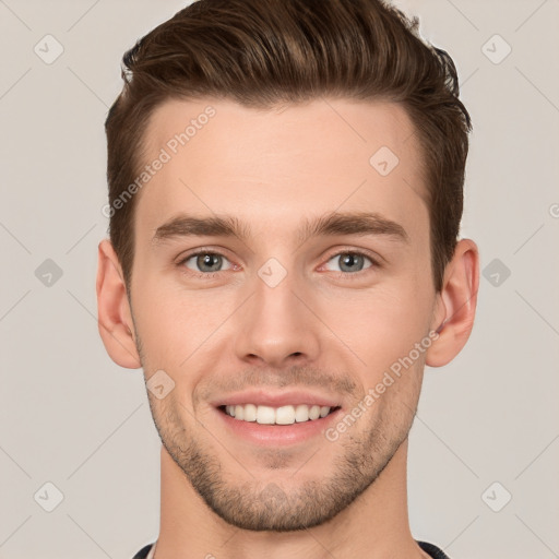 Joyful white young-adult male with short  brown hair and grey eyes