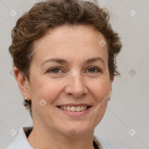 Joyful white adult female with short  brown hair and brown eyes