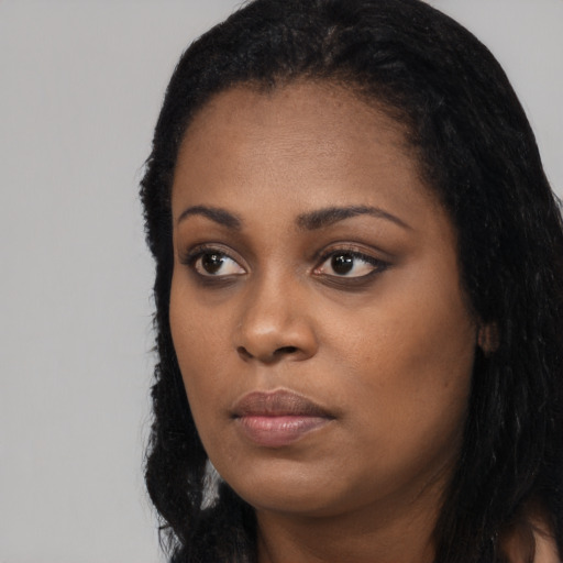 Neutral black young-adult female with long  black hair and brown eyes