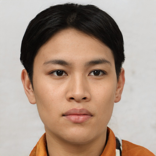 Joyful asian young-adult female with short  black hair and brown eyes