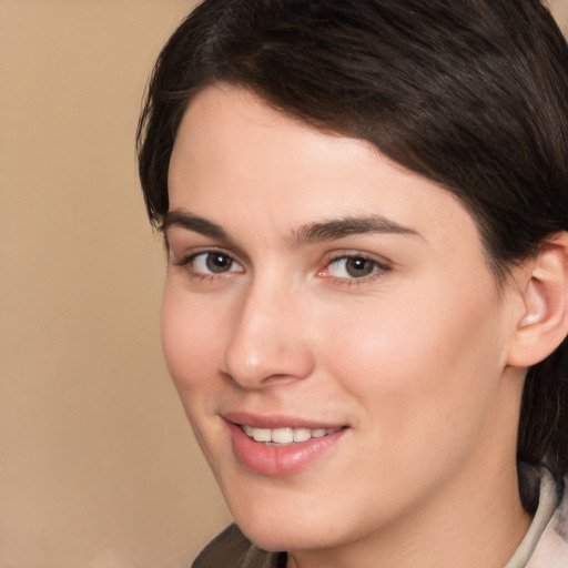 Joyful white young-adult female with medium  brown hair and brown eyes