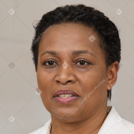 Joyful black adult female with short  brown hair and brown eyes