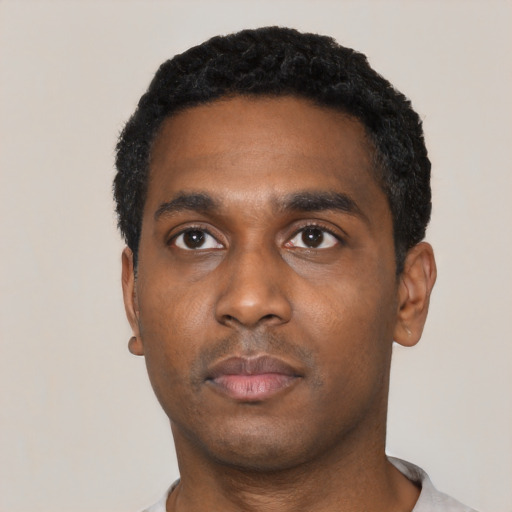 Neutral black young-adult male with short  black hair and brown eyes