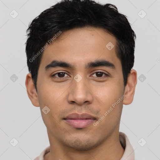 Joyful latino young-adult male with short  black hair and brown eyes