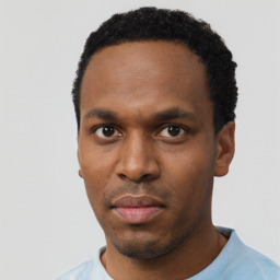 Neutral black young-adult male with short  black hair and brown eyes