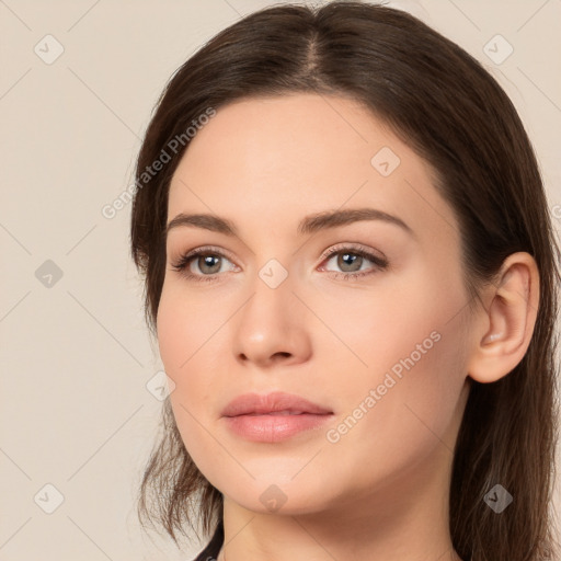 Neutral white young-adult female with long  brown hair and brown eyes