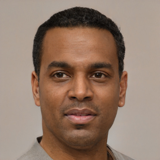 Neutral black young-adult male with short  black hair and brown eyes