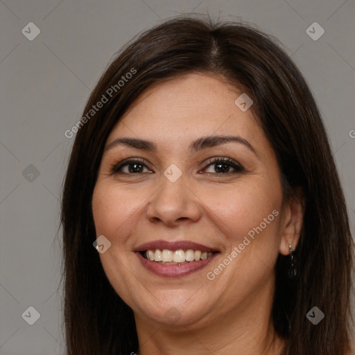 Joyful white adult female with long  brown hair and brown eyes