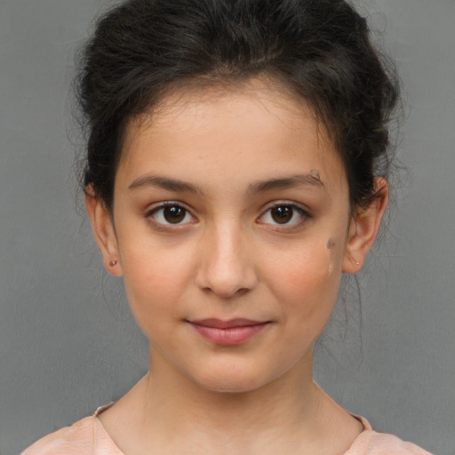 Joyful white child female with short  brown hair and brown eyes