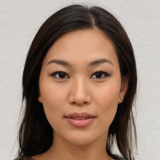 Joyful asian young-adult female with medium  brown hair and brown eyes