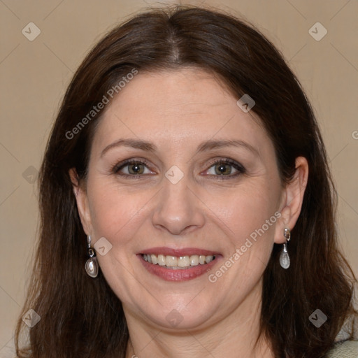 Joyful white adult female with long  brown hair and grey eyes