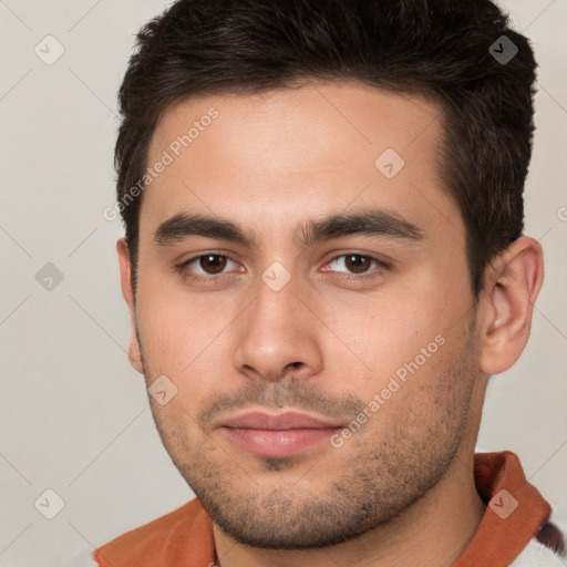 Neutral white young-adult male with short  brown hair and brown eyes