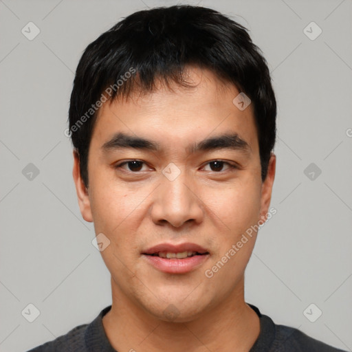 Joyful asian young-adult male with short  black hair and brown eyes