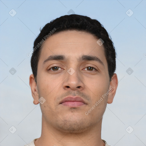 Neutral latino young-adult male with short  black hair and brown eyes