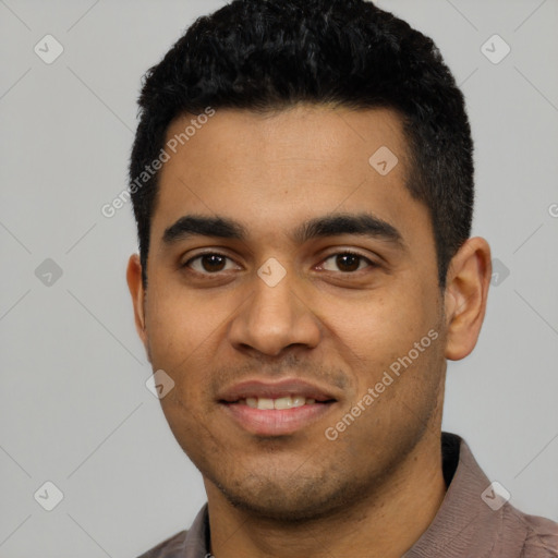 Joyful latino young-adult male with short  black hair and brown eyes