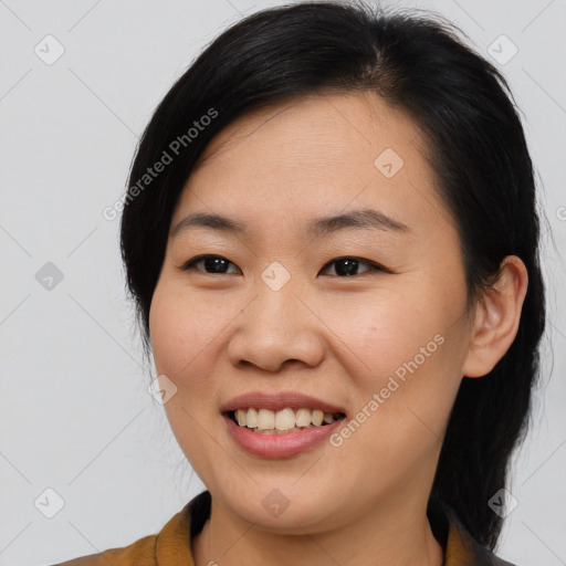 Joyful asian young-adult female with medium  brown hair and brown eyes