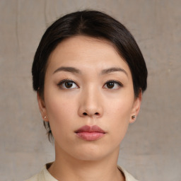 Neutral asian young-adult female with medium  brown hair and brown eyes