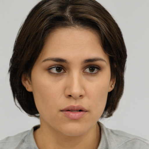 Neutral asian young-adult female with medium  brown hair and brown eyes