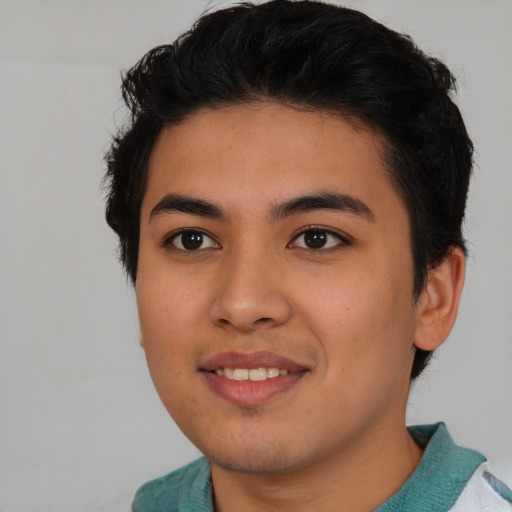 Joyful asian young-adult male with short  brown hair and brown eyes