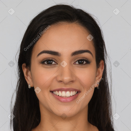 Joyful latino young-adult female with long  brown hair and brown eyes