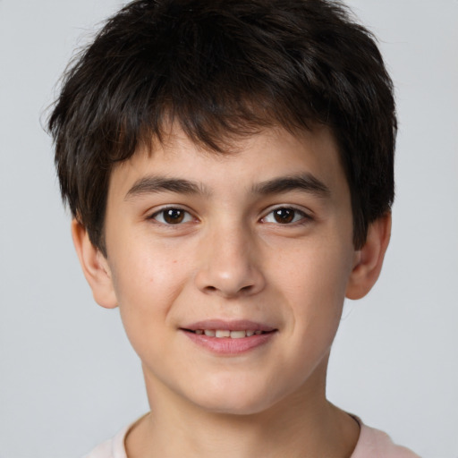 Joyful white child male with short  brown hair and brown eyes