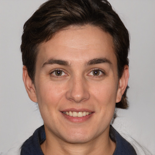 Joyful white adult female with medium  brown hair and brown eyes