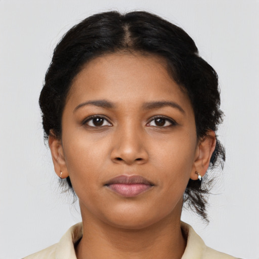 Neutral black young-adult female with medium  black hair and brown eyes
