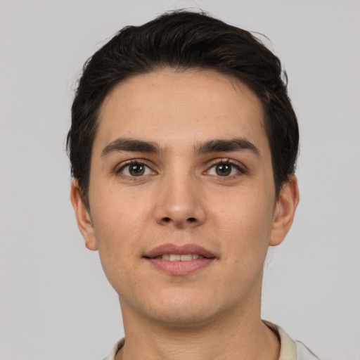 Joyful white young-adult male with short  brown hair and brown eyes