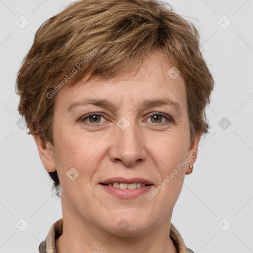 Joyful white adult female with short  brown hair and grey eyes