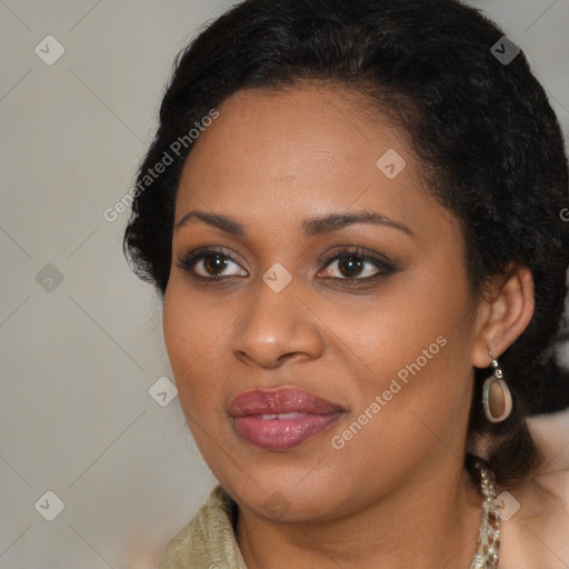 Joyful black young-adult female with long  brown hair and brown eyes