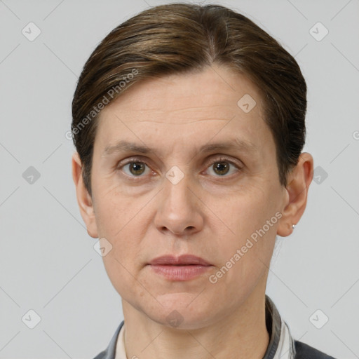 Joyful white adult female with short  brown hair and grey eyes