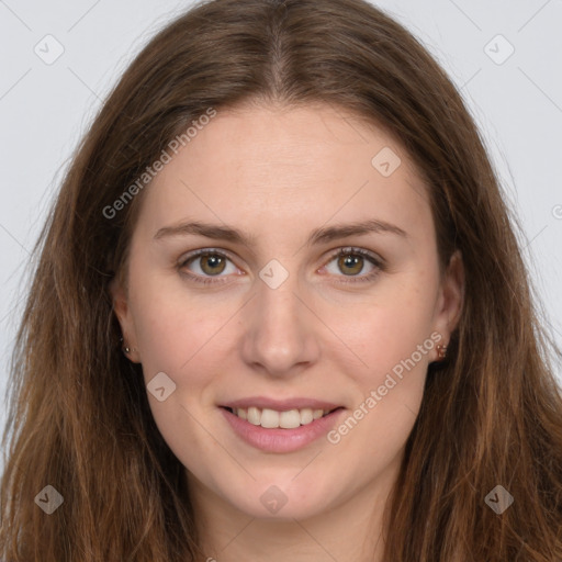 Joyful white young-adult female with long  brown hair and green eyes