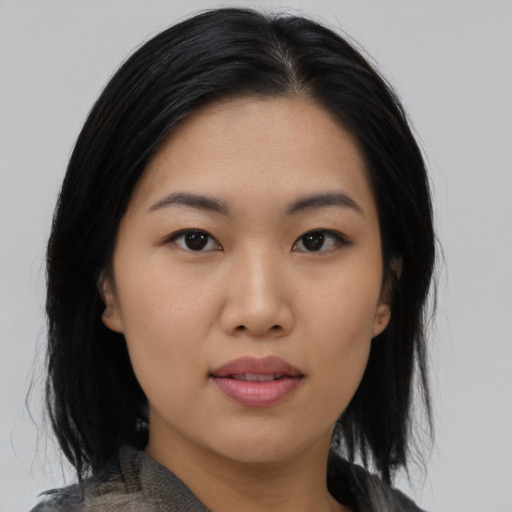 Neutral asian young-adult female with medium  black hair and brown eyes