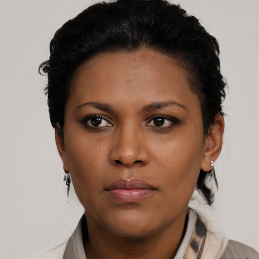 Neutral latino young-adult female with short  black hair and brown eyes