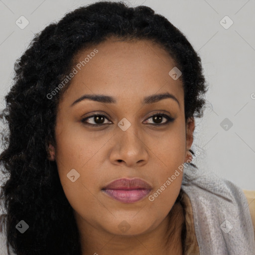 Joyful black young-adult female with long  black hair and brown eyes