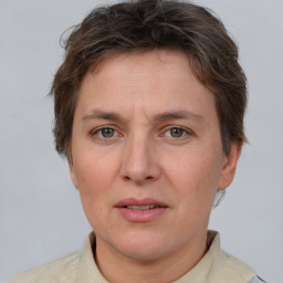 Joyful white adult female with short  brown hair and brown eyes