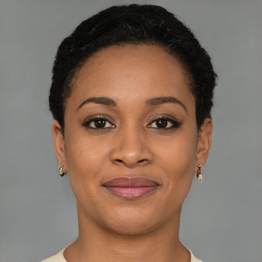 Joyful black young-adult female with short  brown hair and brown eyes