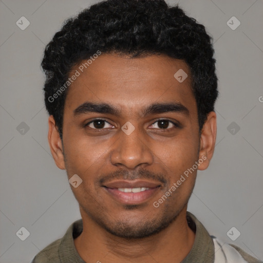 Joyful black young-adult male with short  black hair and brown eyes