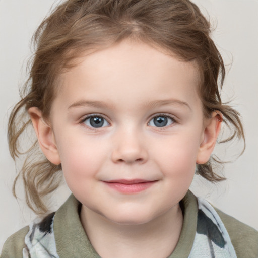 Joyful white child female with medium  brown hair and grey eyes