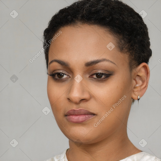 Joyful black young-adult female with short  brown hair and brown eyes