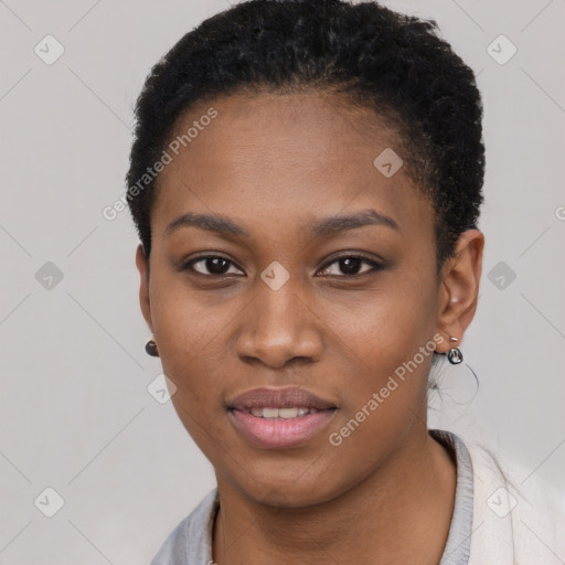 Joyful black young-adult female with short  black hair and brown eyes