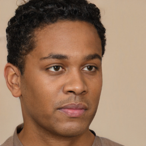 Neutral black young-adult male with short  brown hair and brown eyes