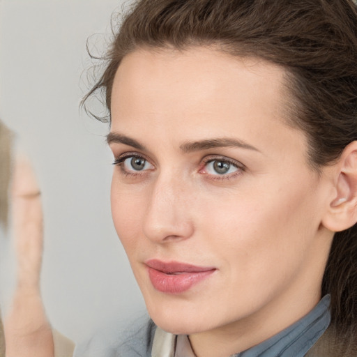 Neutral white young-adult female with medium  brown hair and brown eyes