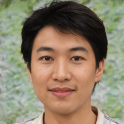 Joyful asian young-adult male with short  black hair and brown eyes