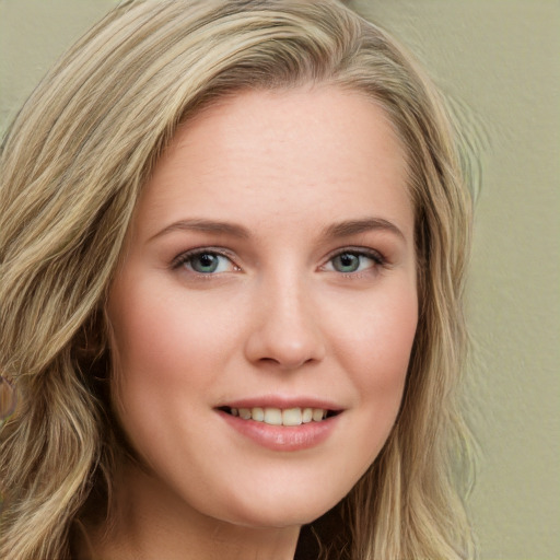 Joyful white young-adult female with long  brown hair and green eyes