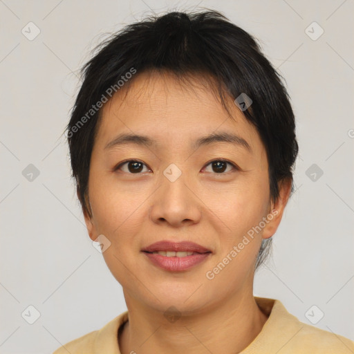 Joyful asian young-adult female with short  brown hair and brown eyes