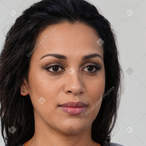 Joyful latino young-adult female with long  brown hair and brown eyes