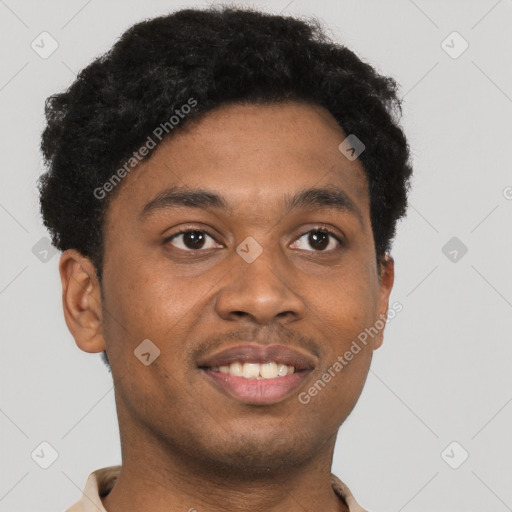 Joyful black young-adult male with short  brown hair and brown eyes