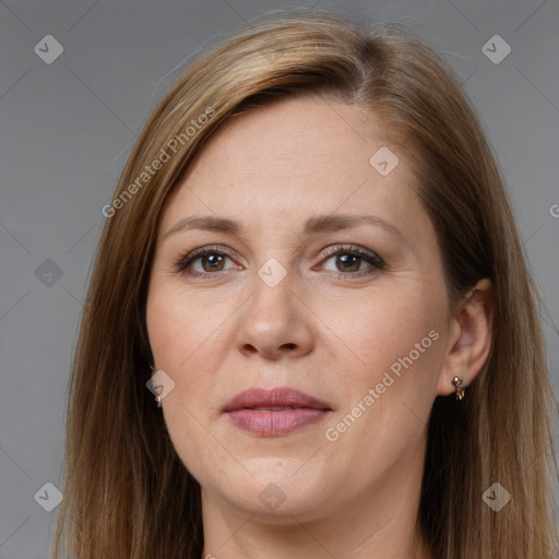 Joyful white adult female with long  brown hair and brown eyes